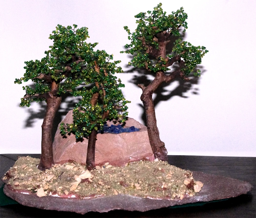 boschetto di 3 bonsai di perline su pietra